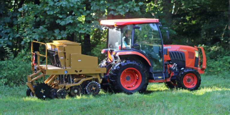 Kubota tractor pulling Esch no-till drill to plant food plot